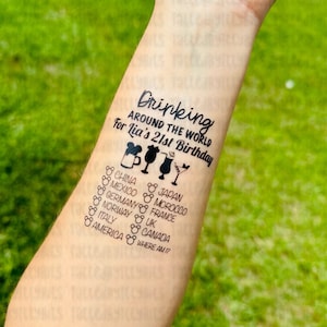 May include: A temporary tattoo with the text "Drinking around the world for Lia's 21st Birthday" and a list of countries including China, Mexico, Germany, Japan, Morocco, France, Norway, UK, Italy, Canada, and America. The tattoo also includes a Mickey Mouse head and a cocktail glass.