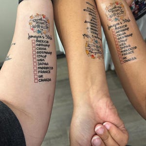 May include: Two people's arms with temporary tattoos that say "Drinking Around the World" with a list of countries and checkboxes next to each country.