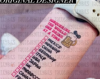 May include: A tattoo design on the forearm with the text "CONQUERING THE WORLD ONE DRINK AT A TIME." A checklist includes countries like Mexico, Norway, and Japan. A beer stein graphic is also included.