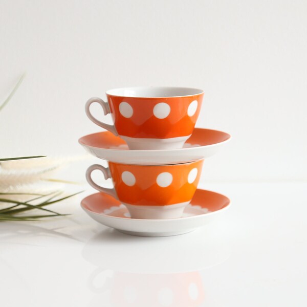 Set of cup and saucer in vibrant polka dot red produced by Riga Porcelain Factory