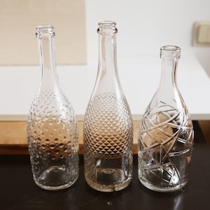 Clear glass wine bottle with hexagonal pyramid pattern