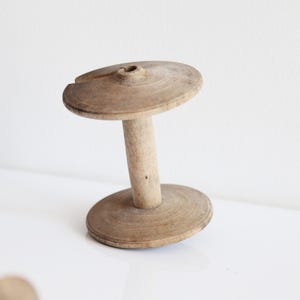 Antique Wood Spinning Wheel Bobbin: Rustic Textile Memorabilia