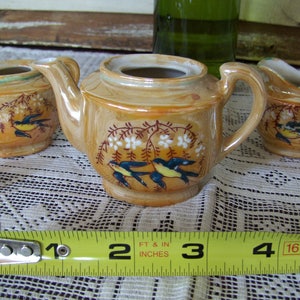 Miniature child&#39;s tea set with bird design, burnt orange teapot, sugar and creamer. Jr tea party toy. Vtg 1970s ceramic set made in Japan.