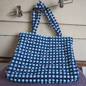 Retro beaded hand bag acrylic bead exterior and straps. Metal zipper, fabric lining. Vintage hippie boho made in Hong Kong.