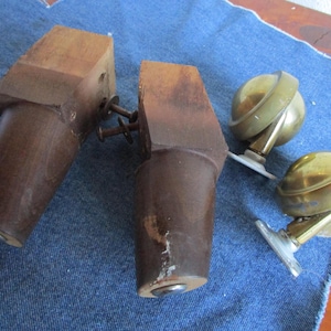 May include: A white ceramic mug with a black handle and the text "But First, Coffee" in a bold, black font. The mug is set against a blurred background, suggesting a cozy setting.