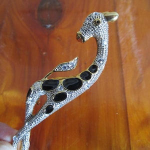 Antelope giraffe brooch w rhinestones and black enamel paint. 4 inches for coat, hat, festive Safari or Mardi Gras decor.
