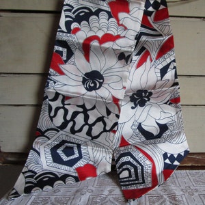 Long neck scarf 64x6 inch. Red white blue abstract floral geometric. Retro modern design. Vintage 1980s durable gently used condition.