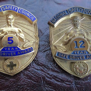 Lot of 9 National Safety Council &quot;Good driver service pins badges. All same size with minor variation in design. Vintage 1970s & earlier.