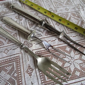 Fork carving serving utensil with sterling handle. Midcentury or earlier in used condition. Price per piece. Contact to combine items.