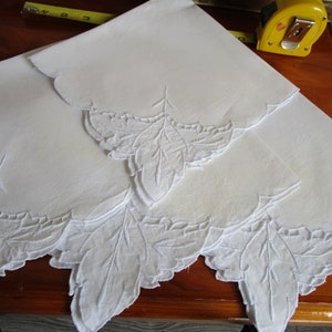 Cloth napkins; set of 12. Vintage blue embroidered w leaf corner embellisment and cutouts.