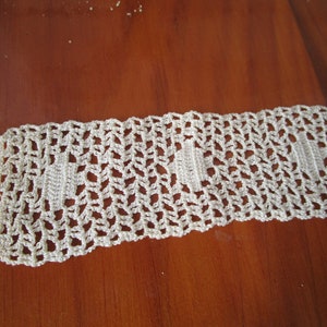 Hand woven lace, pre-WWII through mid-century. Approximately 44 inches long, 1.5 inches wide, pillow case, curtain or belt trim?