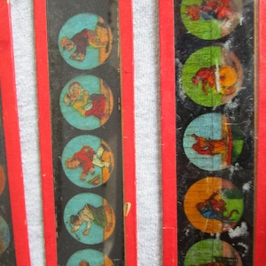 Colored glass lantern shades. Early 1900&#39;s slides, painted glass. 10 slides in good to distressed condition.