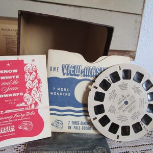 Viewmaster  stereoscope, midcentury slideshow in kodachrome with wheel reels. Wonders of the world, Xmas, Seven dwarves.