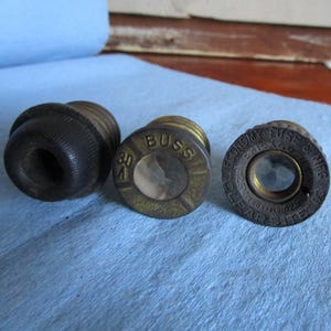 Three vintage screw in fuses. Pre WWII era with porcelain bases and patent numbers. Steampunk craft projects?