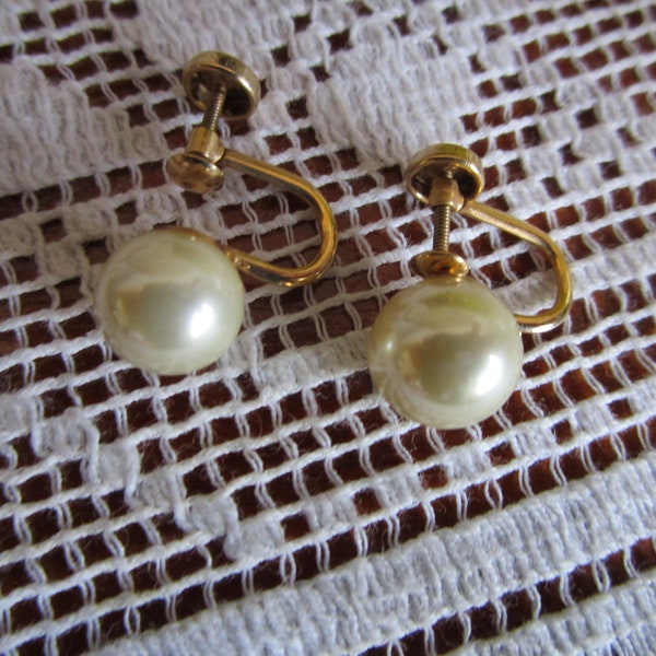 Pearl earrings, 10K gold screw on. 5/16 inch pearls with nice luster. Ship incl in US.