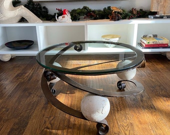 Vintage round iron and glass coffee table with plaster spheres