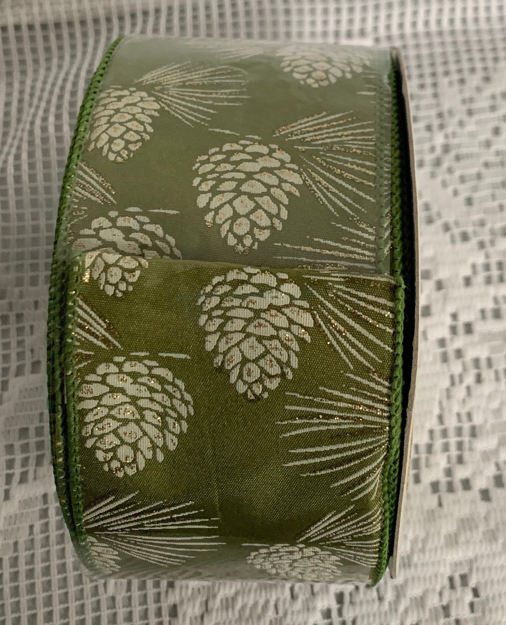 Lion Ribbon New Wired Ribbon Sage Green White Pinecones and Gold Sparkles 2.5” x 25 yards Lion Ribbon New Wired Ribbon Sage Green White Pinecones and Gold Sparkles 2.5” x 25 yards