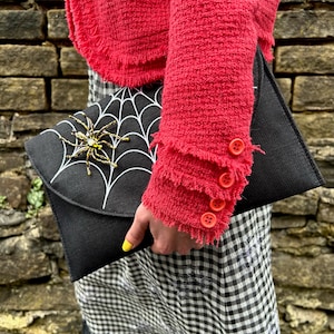 Spiderweb Embroidery Black Jute Envelope Bag with spider brooch