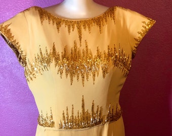1950's Hollywood regency,glamour form fitting below knee elegant dress . HARVEST GOLD w/Gold & Silver hand beaded neckline, one of a kind!