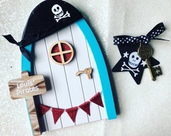 Pirate door with personalised sign post and pirate hat. Pirate fairy door with skull and crossbones