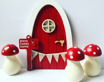 Hand painted red fairy door with personalised sign post