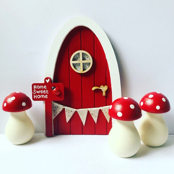 Hand painted red fairy door with personalised sign post