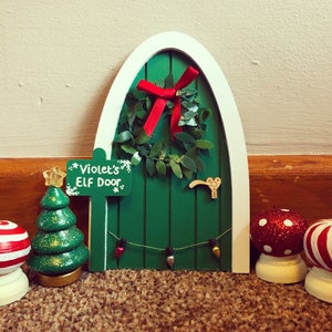 Hand painted christmas door. Fairy or elf door in festive green, with personalised sign post