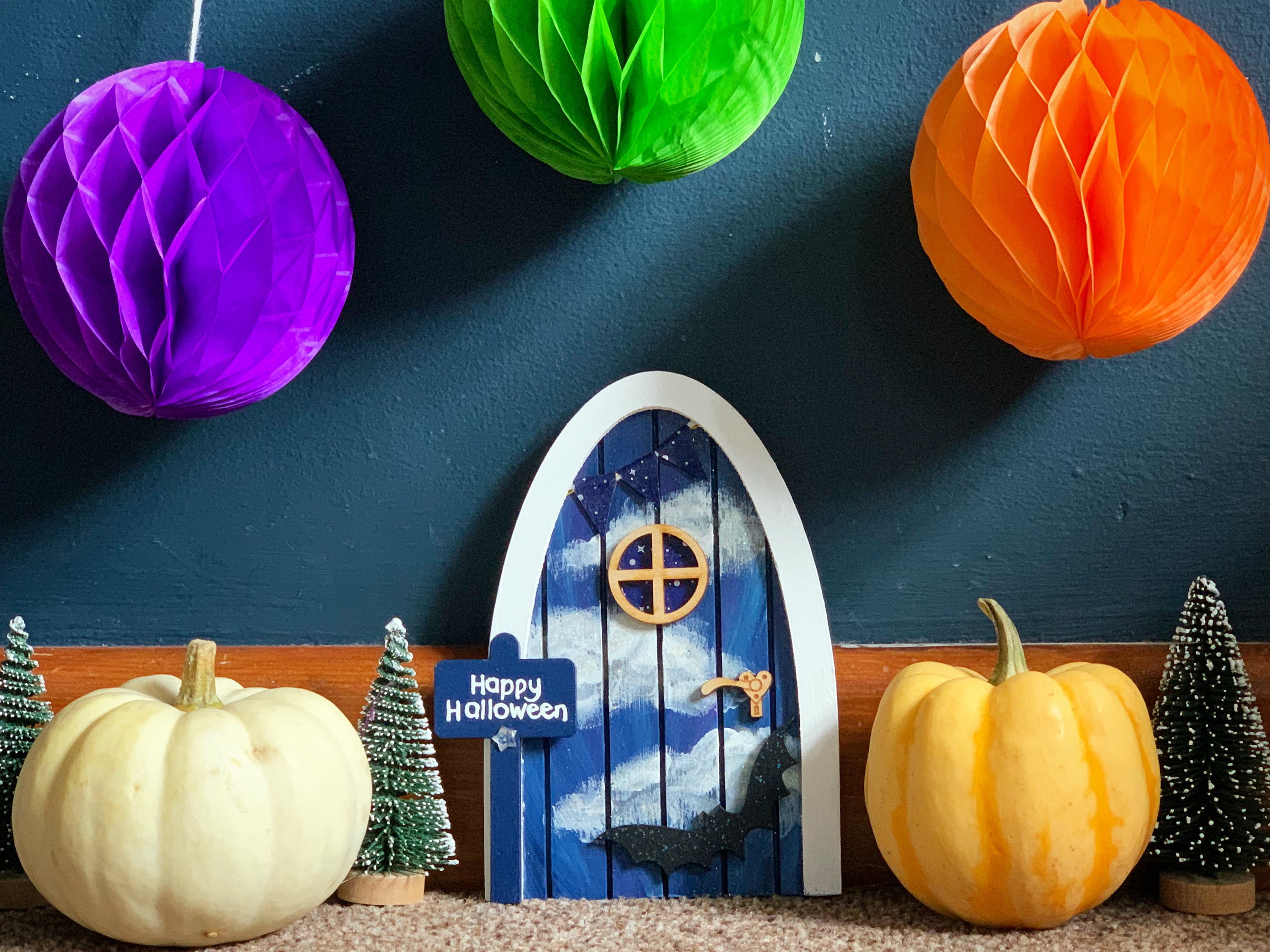 Bat and clouds halloween door. Blue and white fairy door with bat and bunting, and personalised sign post