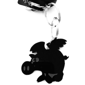Llavero de cerdo volador de dibujos animados, diseño de cerdito con alas, regalo para bolso, color negro