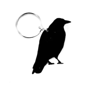 Chaveiro de pássaro corvo com pingente de bolsa em preto
