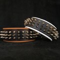 Bestia™ "Danger" Genuine leather Dog Collar with screw spikes and soft leather cushion. 2.5 inch wide. Top Quality! Handmade in Europe! product logo