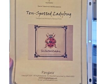 May include: A cream-colored paper pattern sheet titled Ten-Spotted Ladybug, featuring a central illustration of a red ladybug with black spots. The text includes Professor Puddin's Wonderous Stitches Collection, Special Nashville Market Edition, and Pangaea.