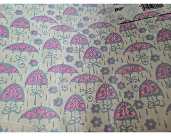May include: A light beige paper featuring a repeating pattern of gray umbrellas with pink accents and small gray flowers. Vertical lines represent rain falling between the umbrellas. A barcode and text are visible in the upper right corner.