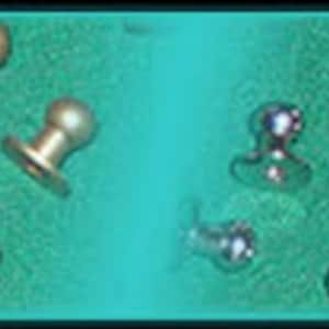 May include: Assortment of small, round, metal, decorative studs. Some are gold-toned and some are silver-toned. The studs have a flat base and a round top.