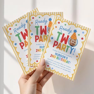 May include: Three rectangular birthday party invitations with yellow and white vertical stripes on the edges. The text reads Ready TWO PARTY! and includes details for Hudson's 2nd birthday, featuring a small circular photo of a child in a party hat.