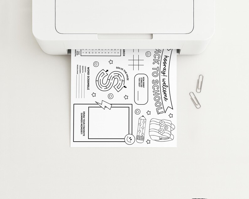 May include: A white printer printing a black and white activity sheet with the text "hooray! welcome BACK TO SCHOOL!". The sheet includes a maze, word scramble, and space to draw a summer memory. Two silver paper clips are on the white surface.