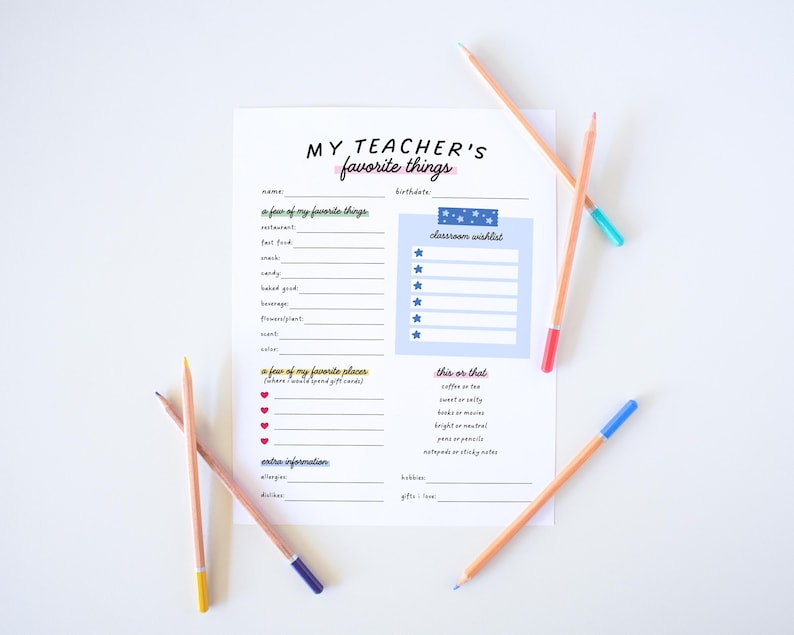 May include: A white sheet of paper with the text "MY TEACHER'S favorite things" and a fill-in-the-blank format. Several pencils with colored tips are scattered around the paper, including blue, red, green, and yellow.
