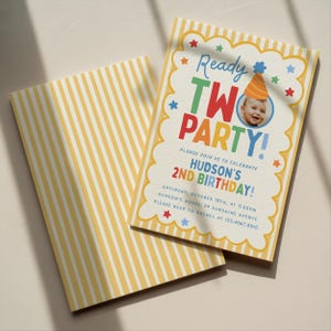 May include: A rectangular birthday invitation card with a yellow and white striped border. The text reads Ready TWO PARTY! Hudson's 2nd Birthday, Saturday, October 18th, at 3:00pm, Hudson's house, 24 Sunshine Avenue, please RSVP to Rachel at 123.4567.8910.