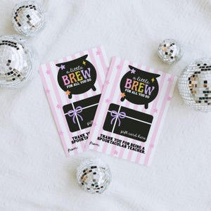 May include: Two gift cards with a pink and white striped background, featuring a black cauldron design with the words "a little BREW FOR ALL YOU DO." The cards also say "gift card here" and "THANK YOU FOR BEING A SPOOKTACULAR TEACHER."