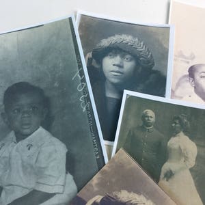 May include: A collection of vintage black and white photographs featuring portraits of people. The photos are in various sizes and are arranged in a collage-like fashion.