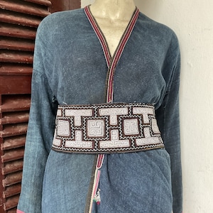 Vintage tribal white Hmong women embroidered cotton belt in Mu Cang chai village,Sapa area,LaoCai province,in the north of Vietnam