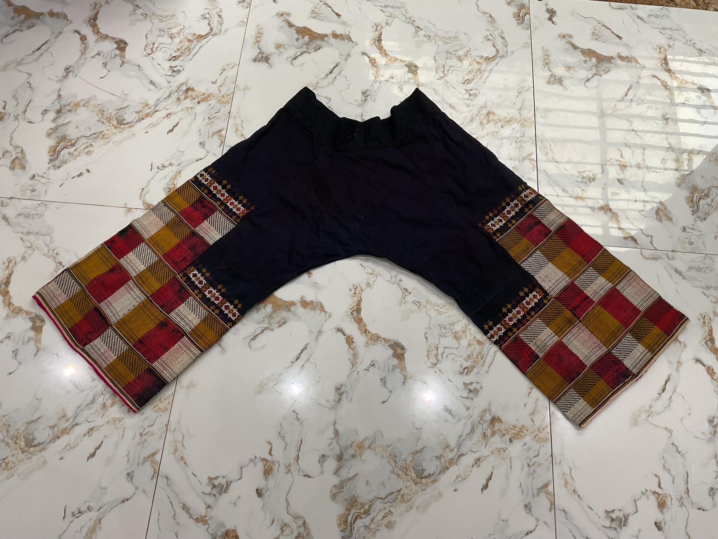 Vintage tribal Red Dao woman pant in Ba Be area,Cao Bang province,in the north of Vietnam