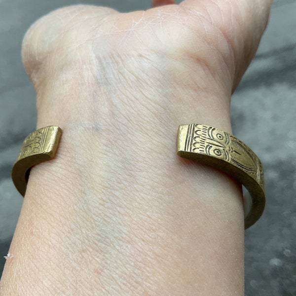 Vintage tribal Red Dao metal copper bracelet in CaoBang area,north of Vietnam and antique Wooden cat