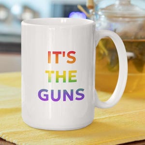 Eye-Catching Rainbow Ombre Mug - 'It's the Guns' - Ceramic Coffee Cup for Gun Reform Advocacy