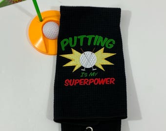 Putting Is My Superpower Golf Towel: Black Microfiber Tri-Fold Sports Towel
