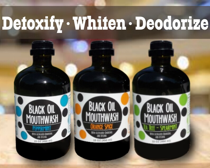May include: Three glass bottles of black oil mouthwash with different flavor options: peppermint, orange spice, and tea tree-spearmint. Each bottle is 15 oz (450 ml).