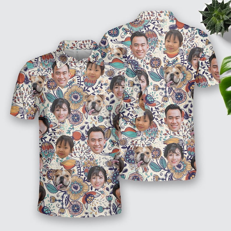 May include: A white short-sleeved button-down shirt with a colorful floral pattern. The pattern includes images of people and dogs.