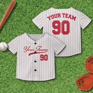 May include: White baseball jersey with red stripes and the text "Your Team" and the number "90" on the back. The front of the jersey has the text "Your Team" and the number "90" in a red cursive font.
