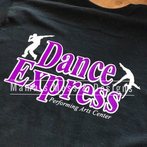 May include: Black t-shirt with a purple and white logo that says "Dance Express Performing Arts Center".