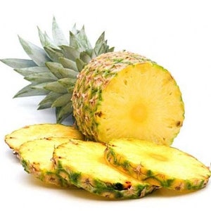 May include: A whole pineapple with a slice cut out and four additional slices on a white background. The pineapple is yellow and green with a brown core. The slices are yellow and green with a brown core.